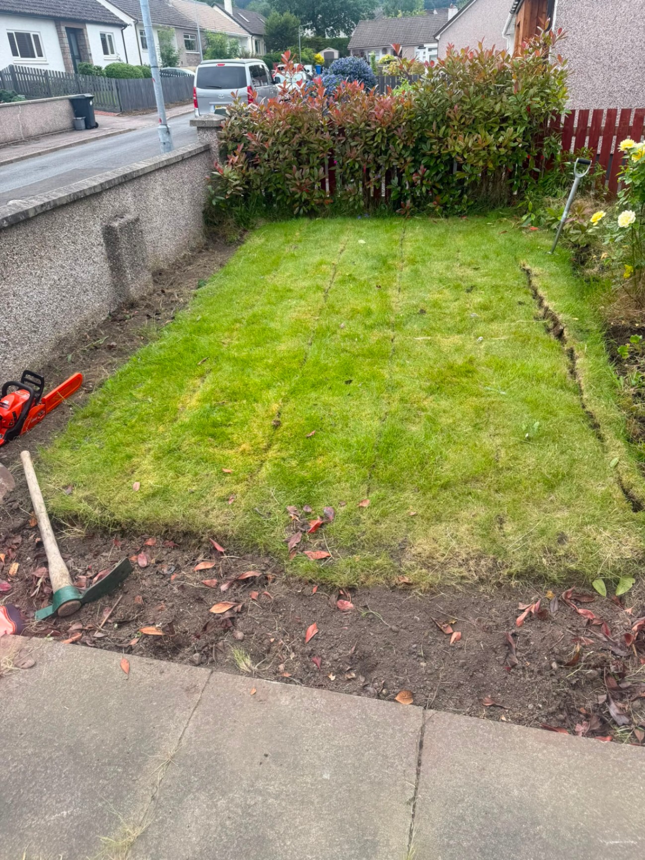 New turf lawn laid on a prepared front garden as part of a full landscaping job in Inverness