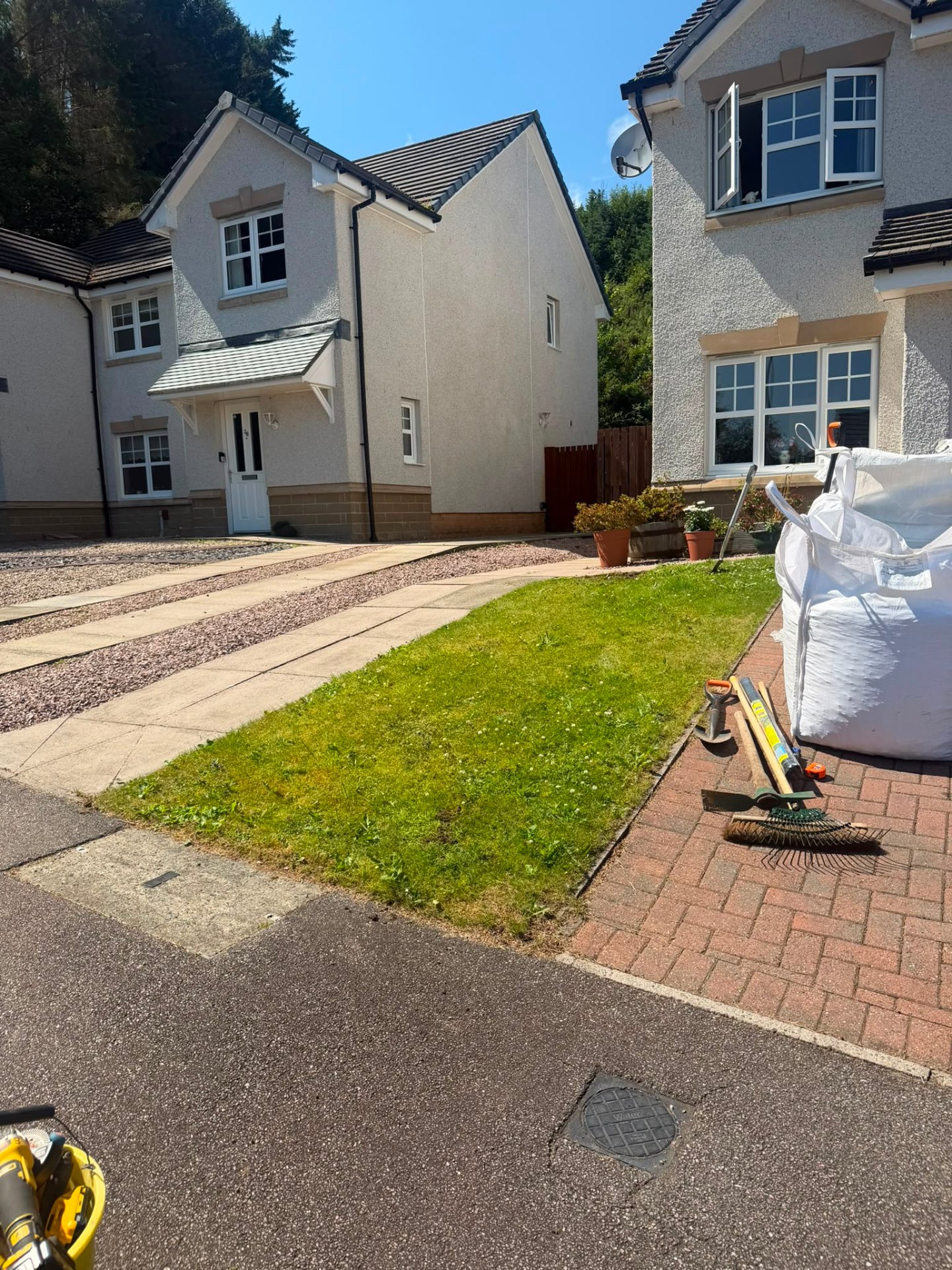 Red gravel path cleared and re-dressed, before